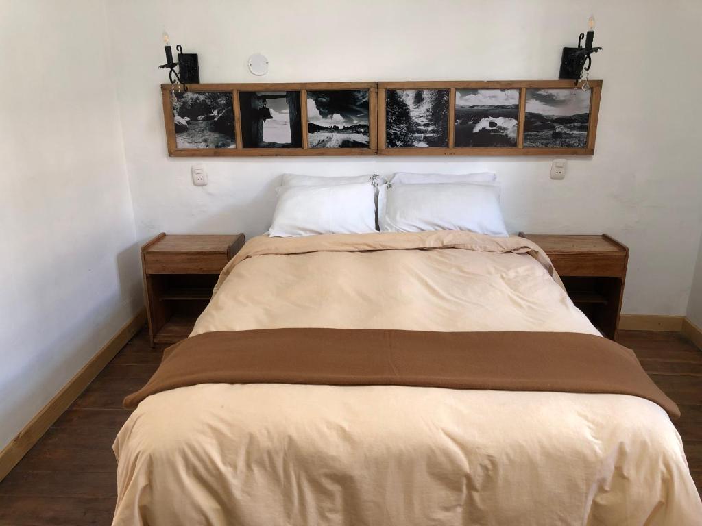 Postel nebo postele na pokoji v ubytování Hostal Qorichaska