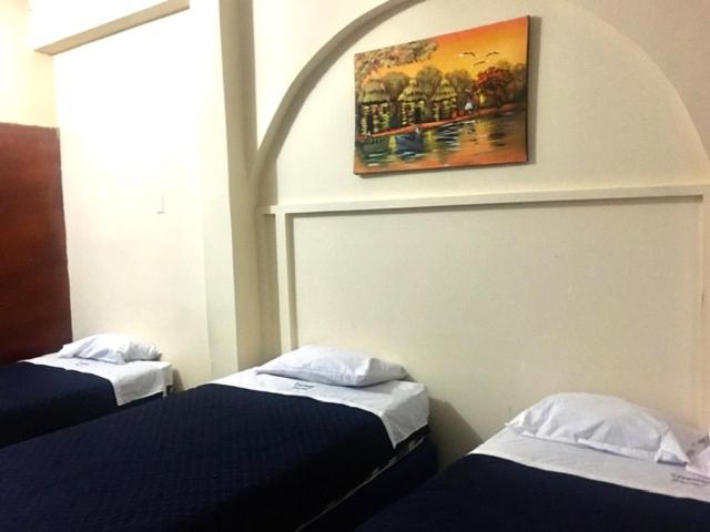 Postel nebo postele na pokoji v ubytování Veranera Hostal