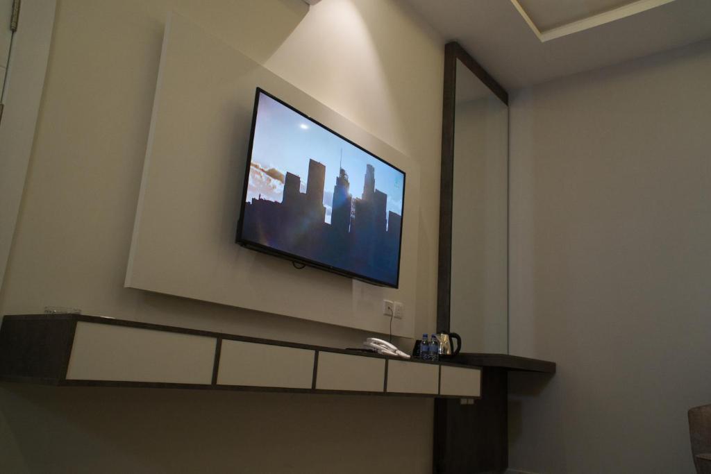 TV a/nebo společenská místnost v ubytování فندق راديانس جراند