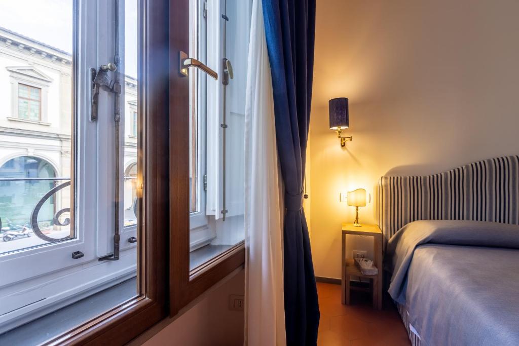 Posteľ alebo postele v izbe v ubytovaní La Casa del Ghiberti B&B