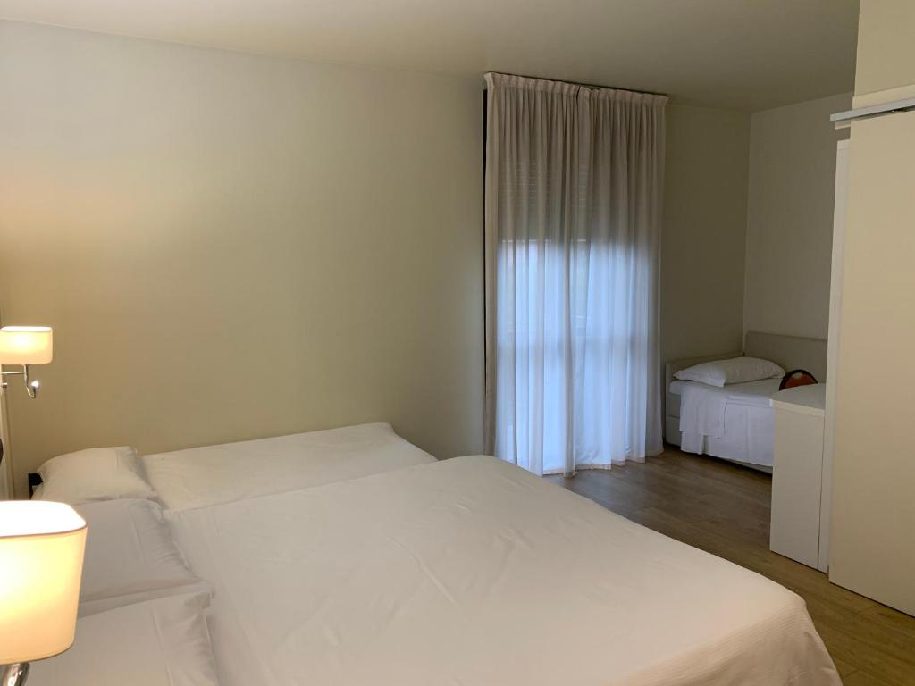 Postel nebo postele na pokoji v ubytování Hotel Parigi 2 & Spa