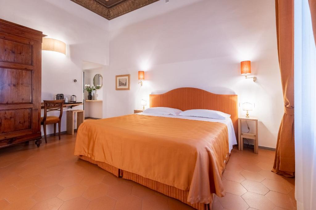 Posteľ alebo postele v izbe v ubytovaní La Casa del Ghiberti B&B