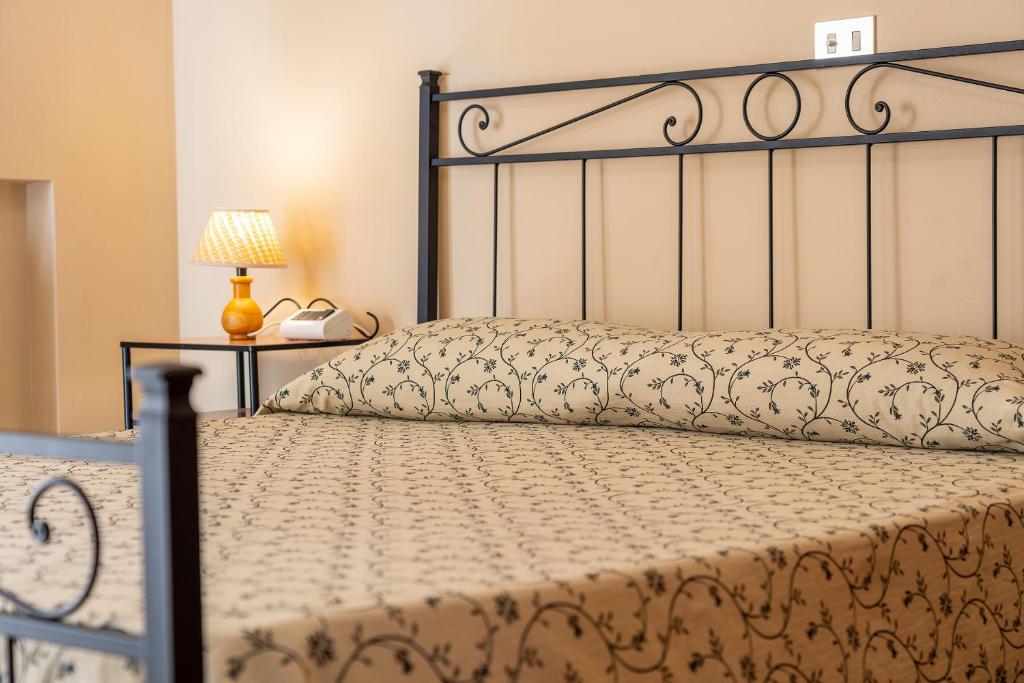Posteľ alebo postele v izbe v ubytovaní Hotel Trasimeno