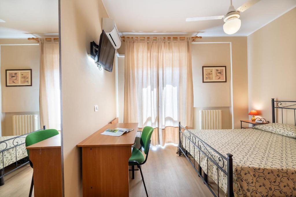 Posteľ alebo postele v izbe v ubytovaní Hotel Trasimeno