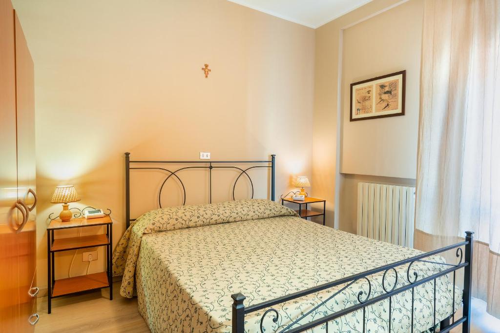 Posteľ alebo postele v izbe v ubytovaní Hotel Trasimeno