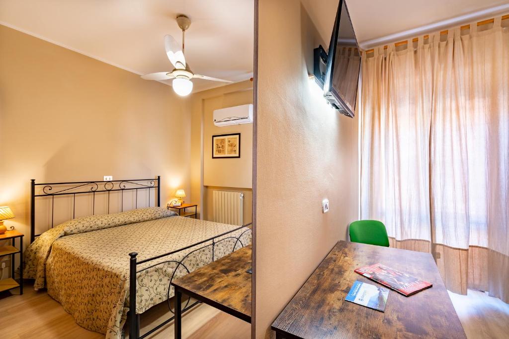 Posteľ alebo postele v izbe v ubytovaní Hotel Trasimeno