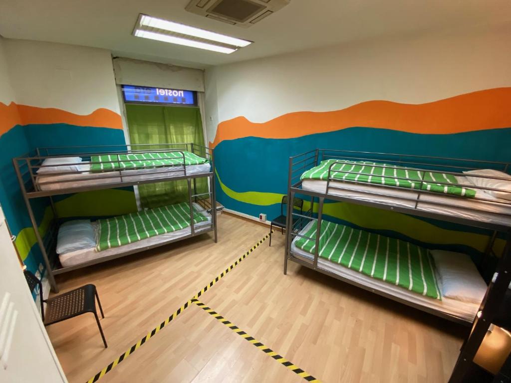 A bed or beds in a room at Bed Madrid Rooms by Bossh! Hotels