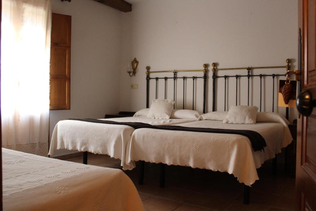 Posteľ alebo postele v izbe v ubytovaní Hotel La Villa