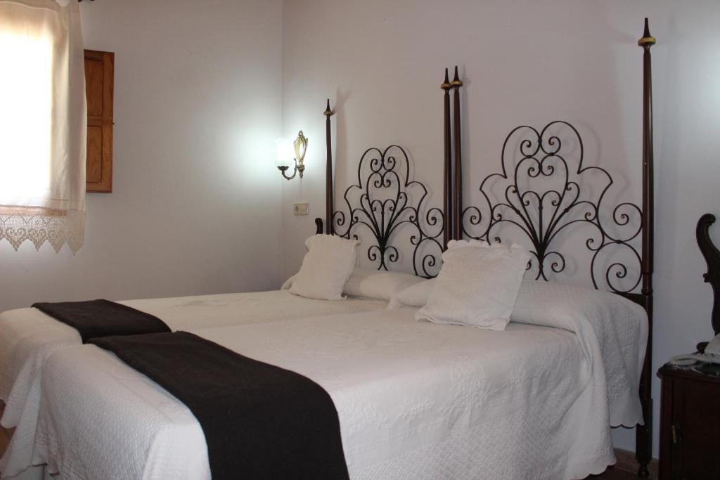 Posteľ alebo postele v izbe v ubytovaní Hotel La Villa