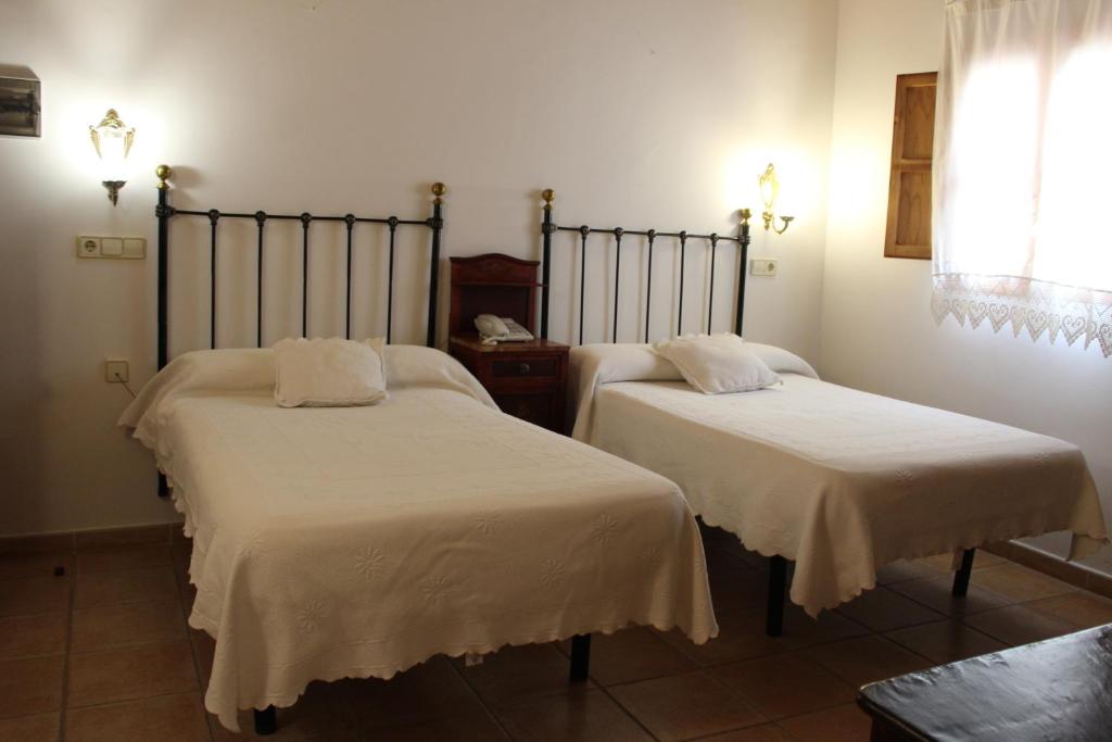Posteľ alebo postele v izbe v ubytovaní Hotel La Villa