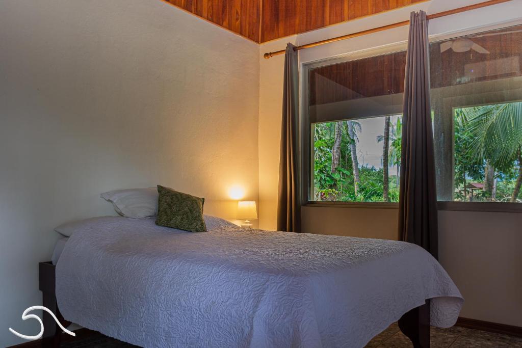Postel nebo postele na pokoji v ubytování Tranquilidad Resort