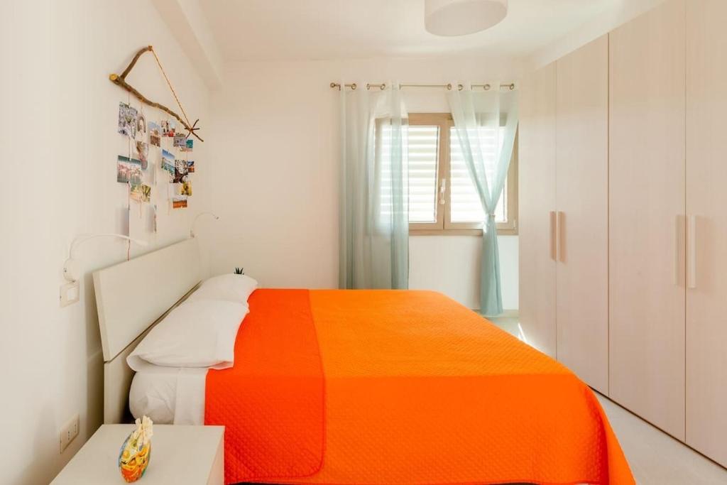 A bed or beds in a room at Casa Vacanze La Primitiva