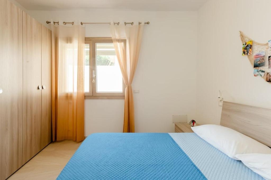 A bed or beds in a room at Casa Vacanze La Primitiva