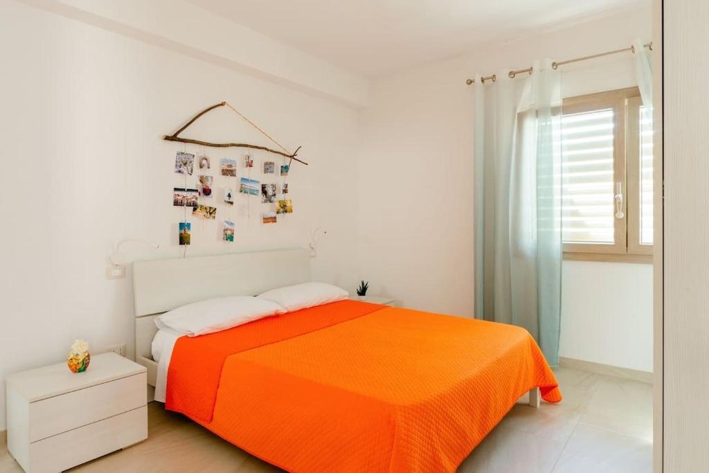 A bed or beds in a room at Casa Vacanze La Primitiva