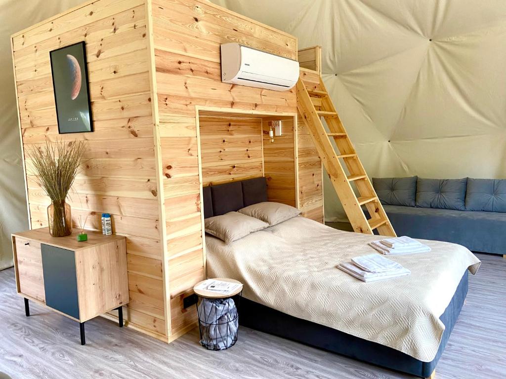 Postel nebo postele na pokoji v ubytování Planeta Glamping