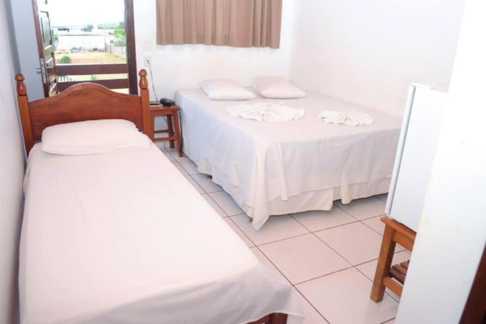Postel nebo postele na pokoji v ubytování Hotel Comodoro