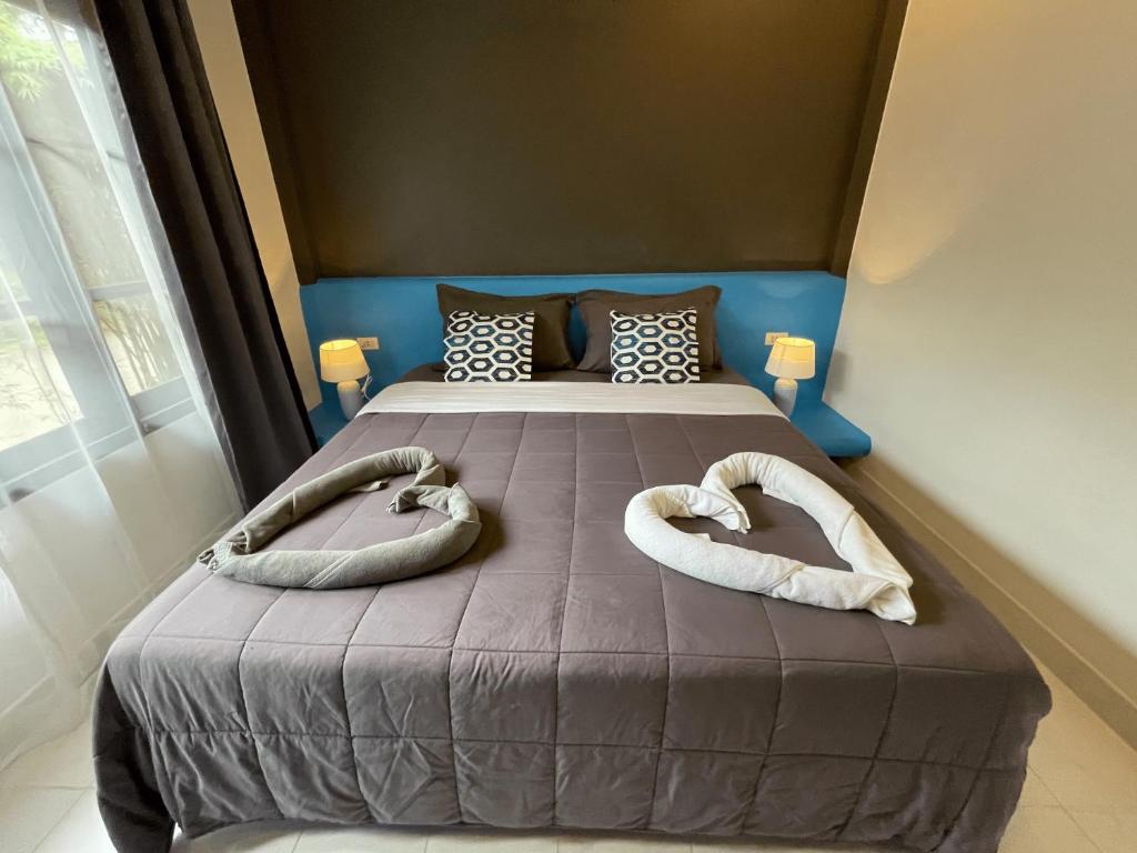 Postel nebo postele na pokoji v ubytování Marilyn’s Resort Koh Samui