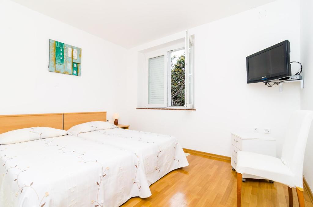 Posteľ alebo postele v izbe v ubytovaní A4-harmony Apartment Close To The Sunset Beach And Lapad Promenade