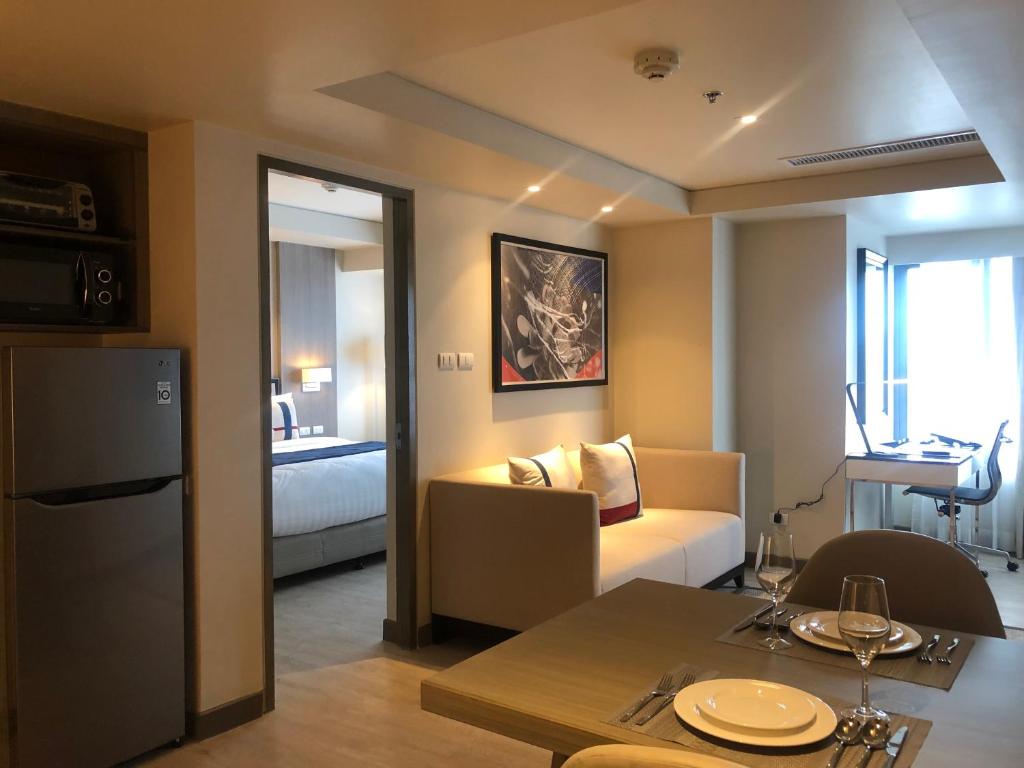 Uma cama ou camas num quarto em Seda Residences Makati