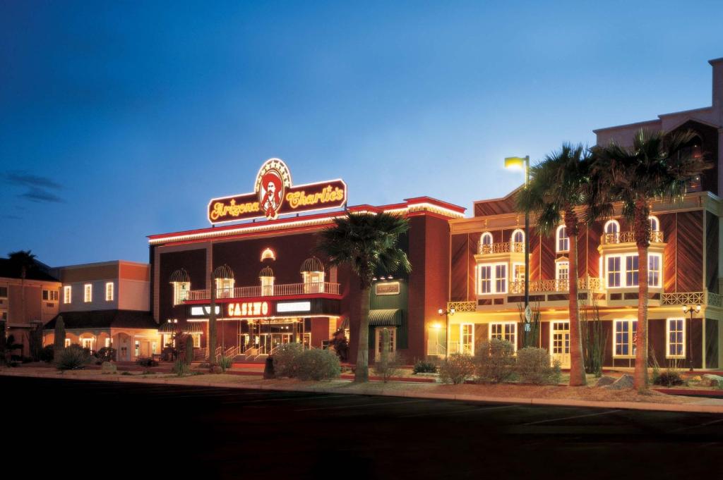 
a large building with a clock on the front of it at Arizona Charlie's Decatur in Las Vegas
