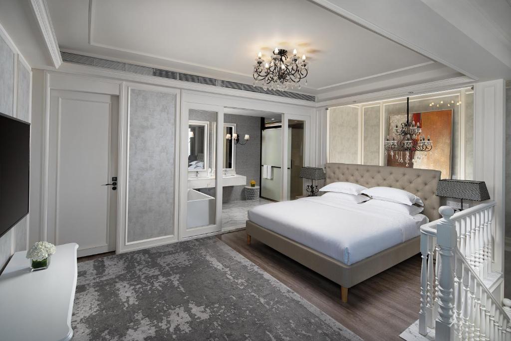 Postel nebo postele na pokoji v ubytování Unijoy Cityinn OCT Loft Shenzhen有集城市客栈创意园店