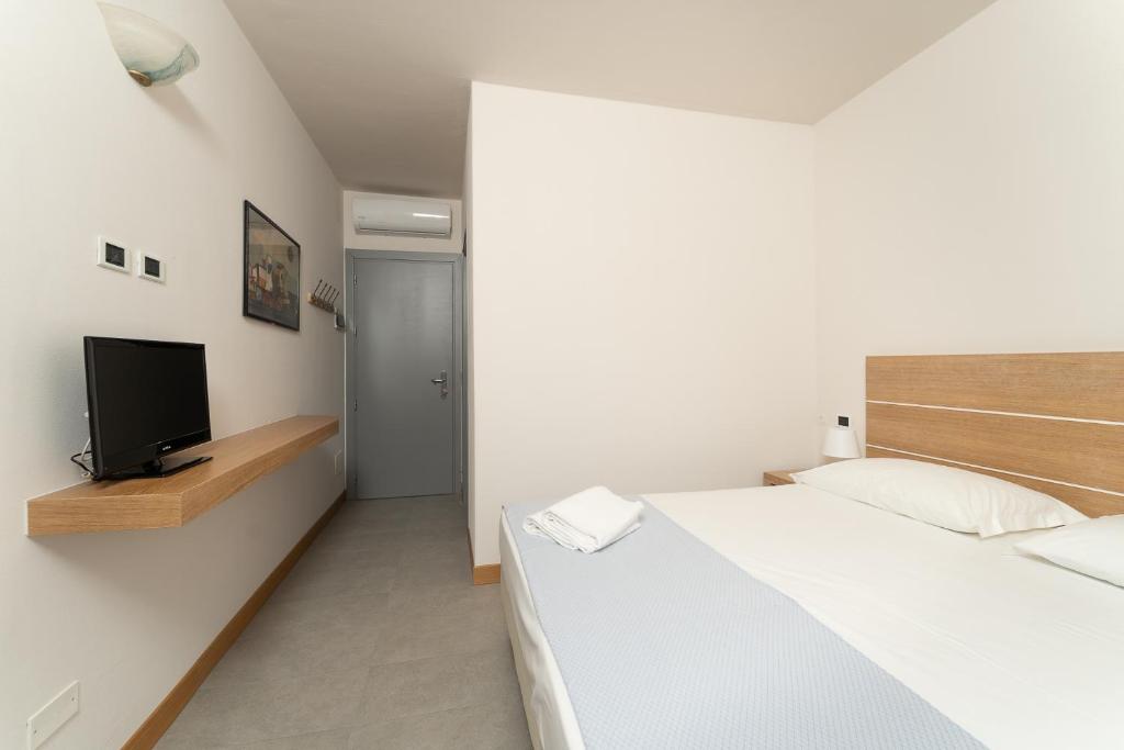 TV a/nebo společenská místnost v ubytování Hotel Delfino