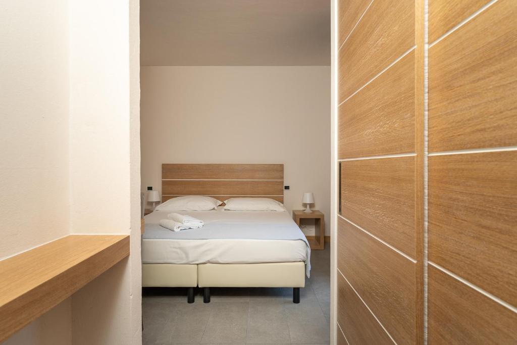 Postel nebo postele na pokoji v ubytování Hotel Delfino