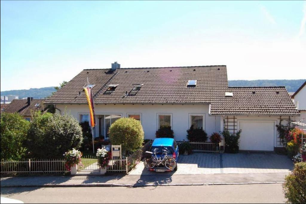 a motorcycle parked in front of a house at Ferienwohnungen Meyer in Beilngries