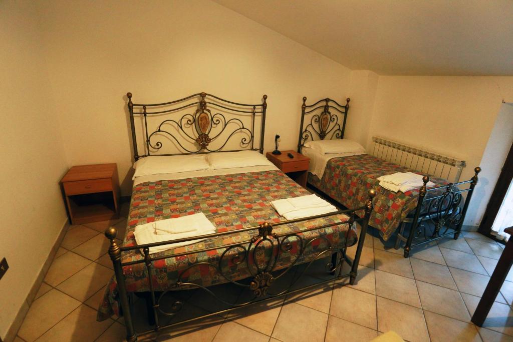 Postel nebo postele na pokoji v ubytování Agriturismo Grisciano