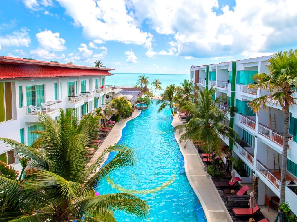 an aerial view of a resort canal between buildings at The Samui Beach Resort in Koh Samui