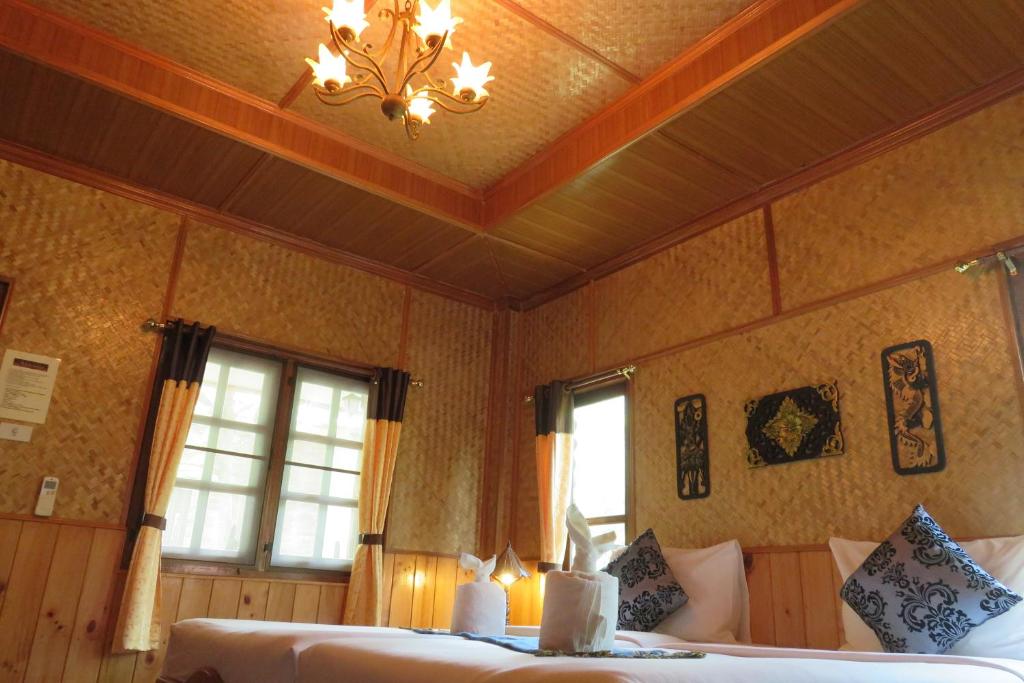 Postel nebo postele na pokoji v ubytování Macura Resort
