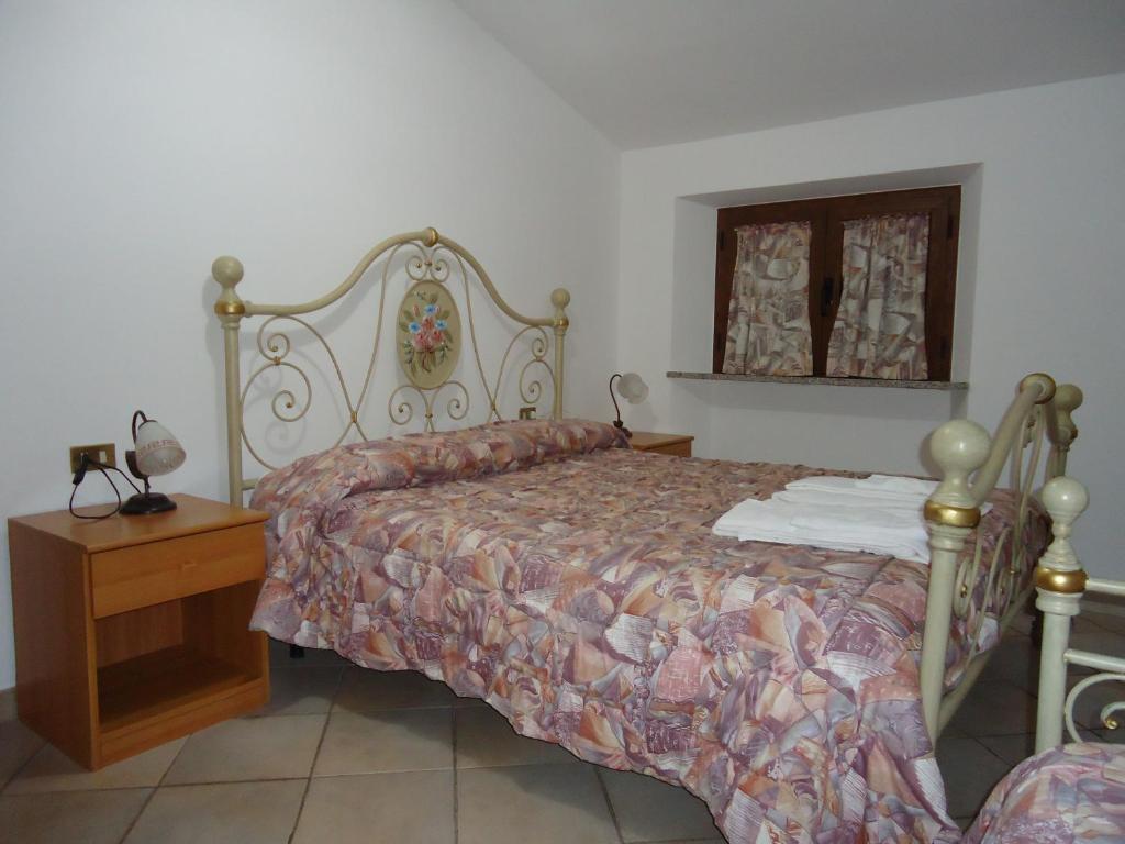 Postel nebo postele na pokoji v ubytování Agriturismo Grisciano