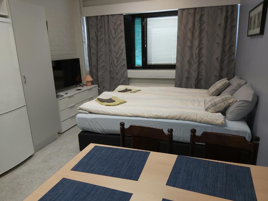Postel nebo postele na pokoji v ubytování Ruskalinna Apartments