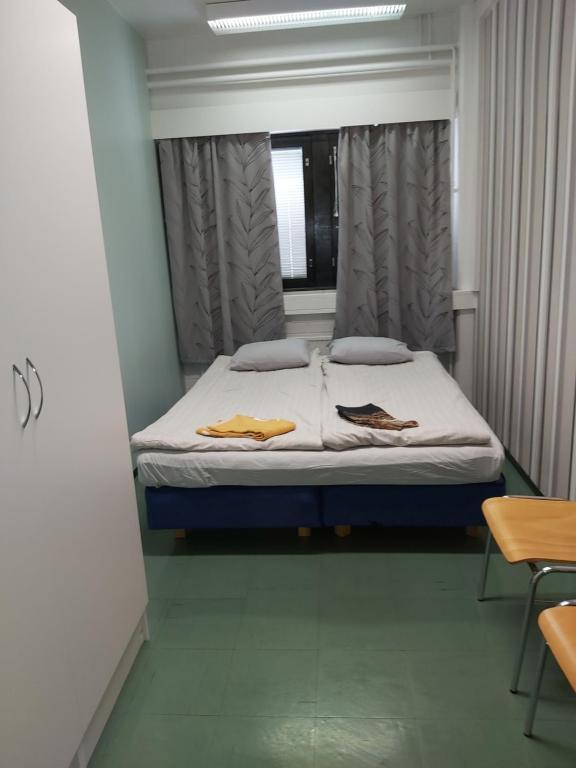 Postel nebo postele na pokoji v ubytování Ruskalinna Apartments