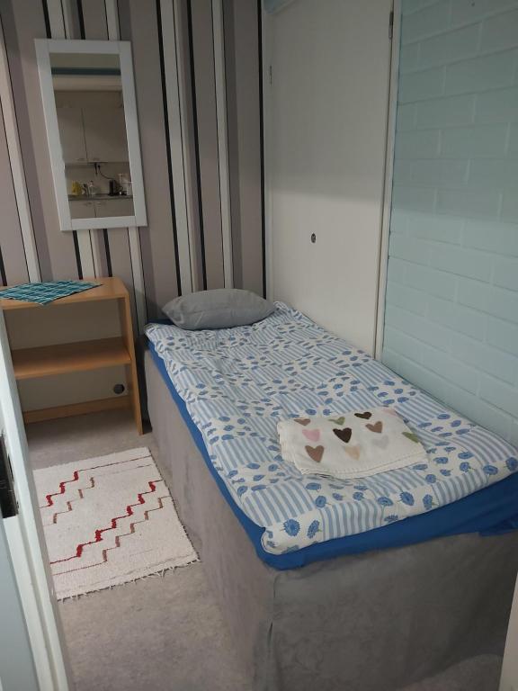Postel nebo postele na pokoji v ubytování Ruskalinna Apartments