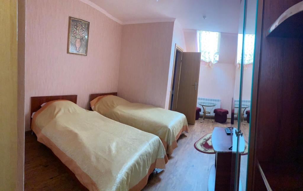 Postel nebo postele na pokoji v ubytování Атлант