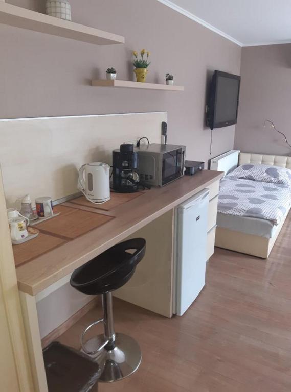 A kitchen or kitchenette at Fáraó vendégház