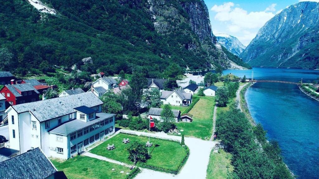 an aerial view of a town next to a lake at Gudvangen Budget Hotel in Gudvangen