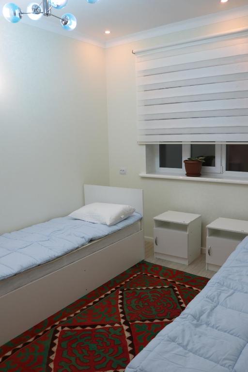 Postel nebo postele na pokoji v ubytování Guest House Semetei