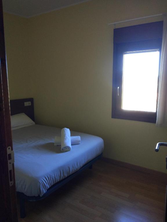 Postel nebo postele na pokoji v ubytování Albergue rural l'Almada de Yebra