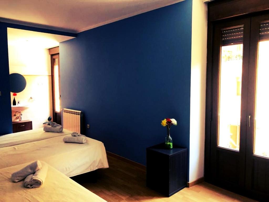 Postel nebo postele na pokoji v ubytování Albergue rural l'Almada de Yebra