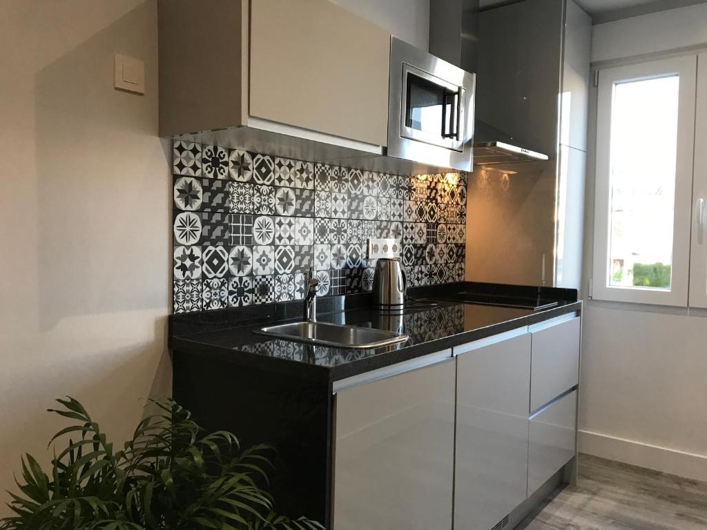 Kuchyňa alebo kuchynka v ubytovaní Apartamentos Ciudad de Ronda