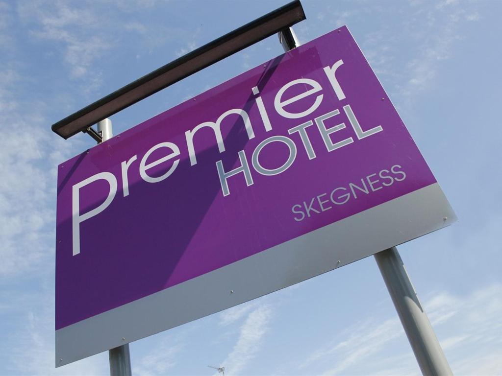 a blue and white sign on a pole at PREMIER HOTEL not Premier Inn in Skegness