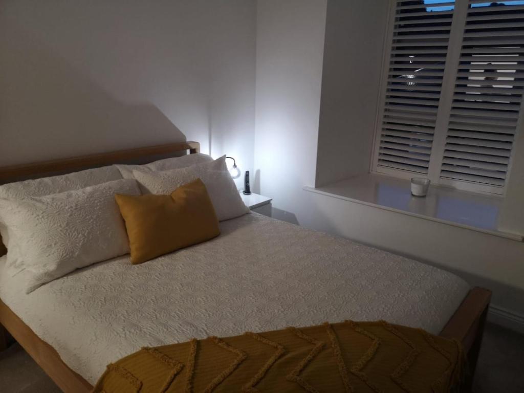 Postel nebo postele na pokoji v ubytování Haworth Hideaway