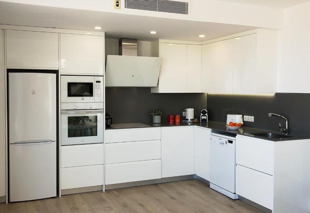 A kitchen or kitchenette at Sea View House with terrace
