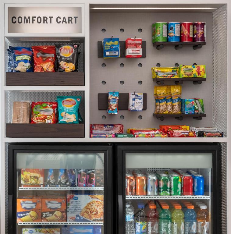 a refrigerator filled with lots of food and drinks at Comfort Inn in Ottawa
