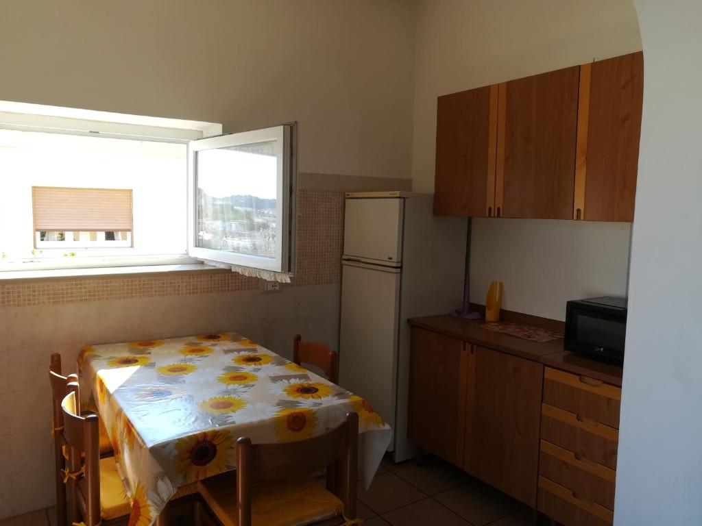 A kitchen or kitchenette at Appartamenti La Balestra