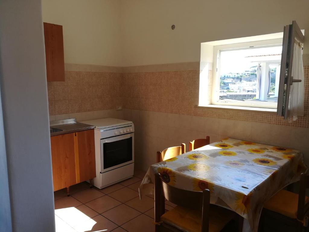 A kitchen or kitchenette at Appartamenti La Balestra