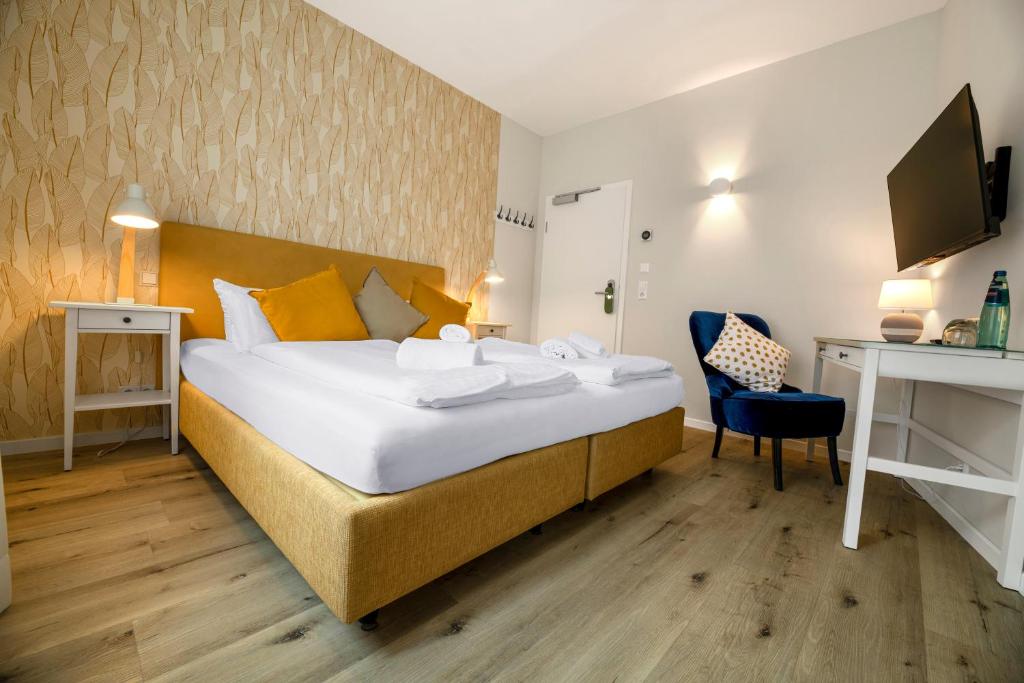 Postel nebo postele na pokoji v ubytování Hotel Seeliebe