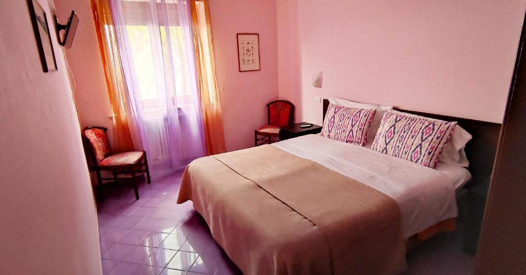Postel nebo postele na pokoji v ubytování Hotel Desiree